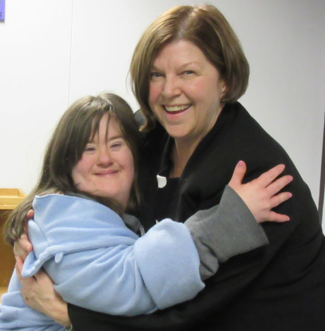 Photo of Meaghan hugging one of her supporters